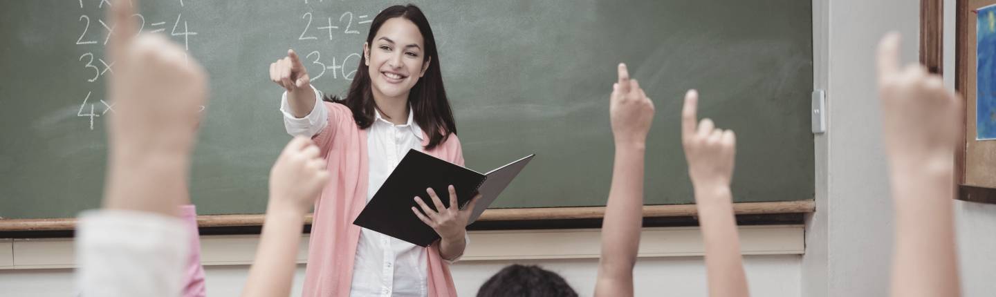 Female teacher calling upon students