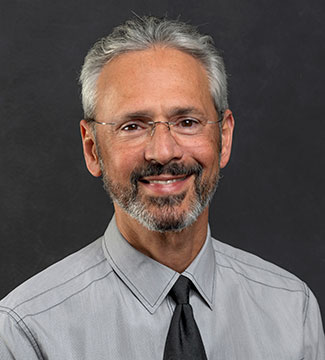 Headshot of Dr. Aviera smiling at the camera