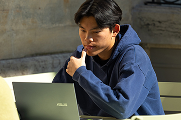 Pepperdine student using his laptop