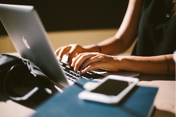 photo of student looking at laptop computer
