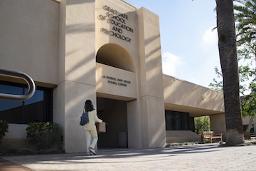 student walking into GSEP campus building