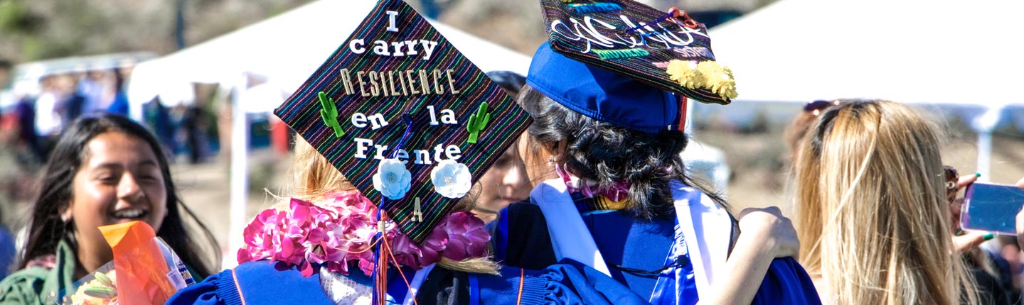 GSEP Aliento graduation students with decorative caps