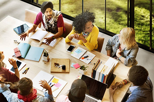 diverse group of people talking in a meeting