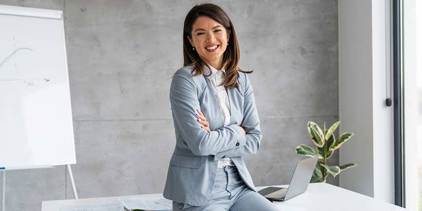 Woman sitting on desk