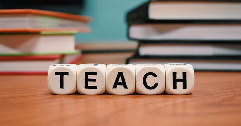 The word teach spelled out on blocks