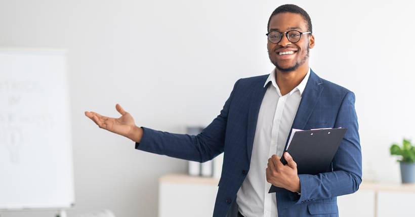 Man presenting at a board