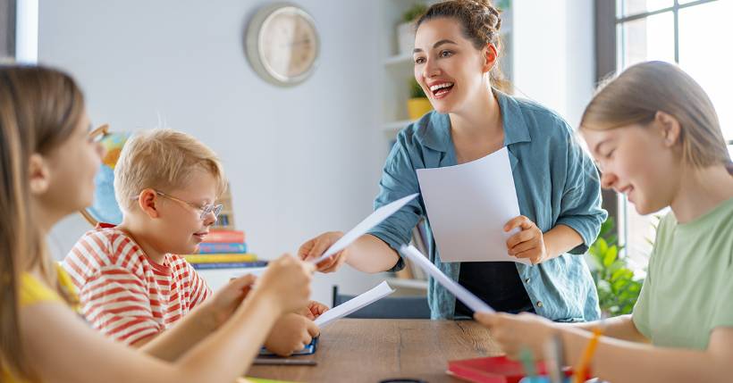 Teacher working with her students