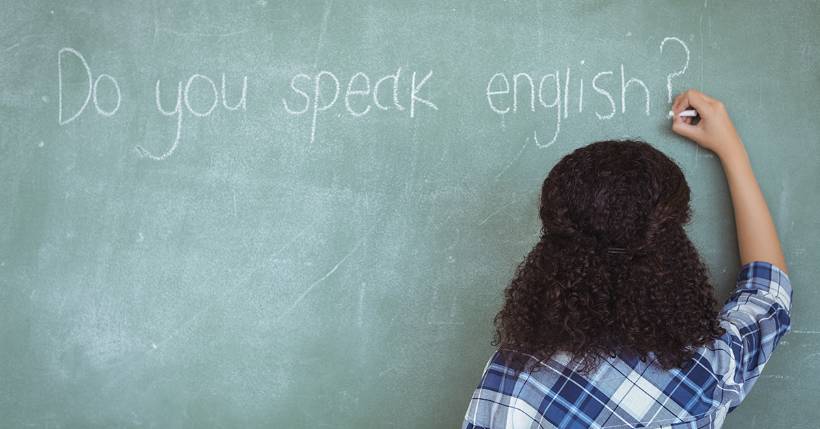 Woman writing on a chalkboard