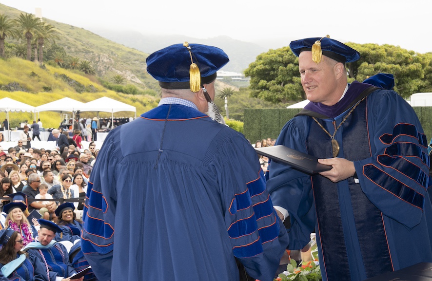 Pepperdine PhD student receiving degree during commencement