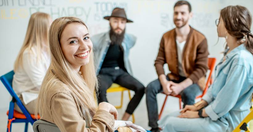 Person smiling in group therapy session