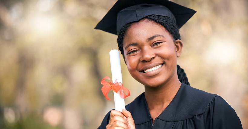 woman holding degree