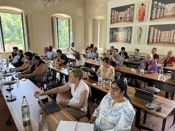 pepperdine doctoral students during international trip in Switzerland sitting to a presentation