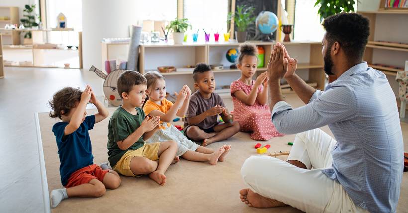 Teacher teaching his students