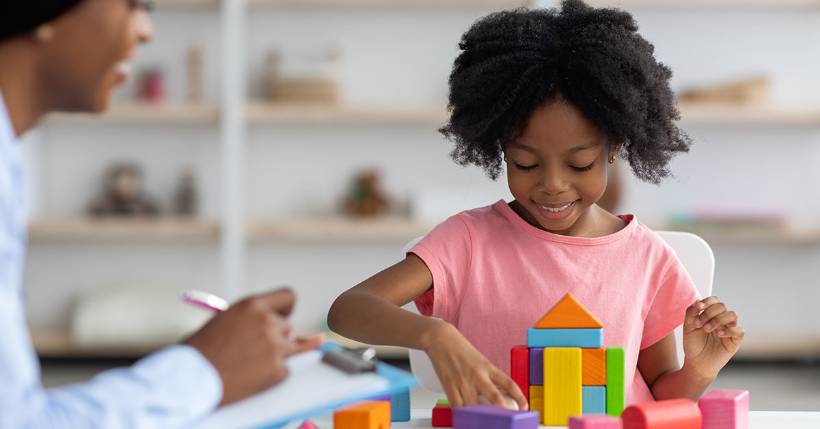 Young girl playing with blocks