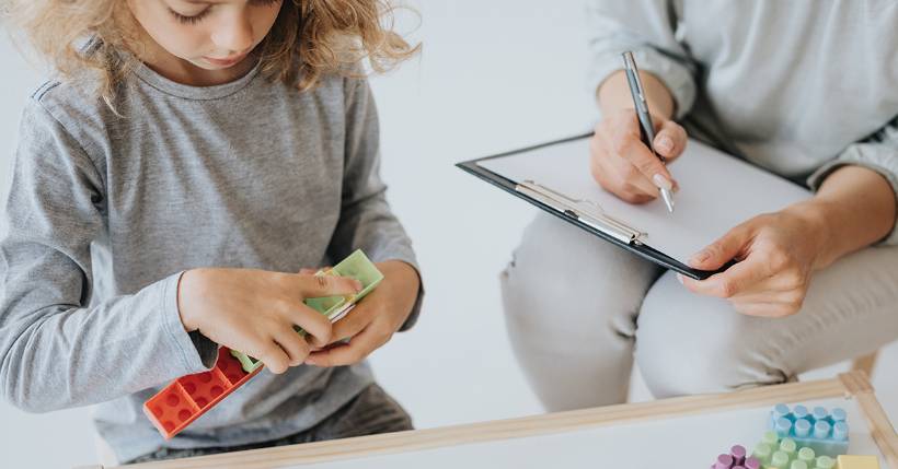 Behavior analyst observing child