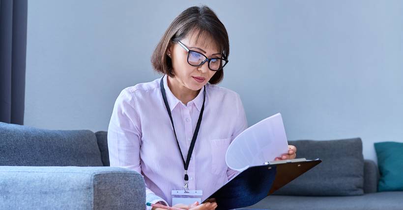 Marriage counselor looking over documents