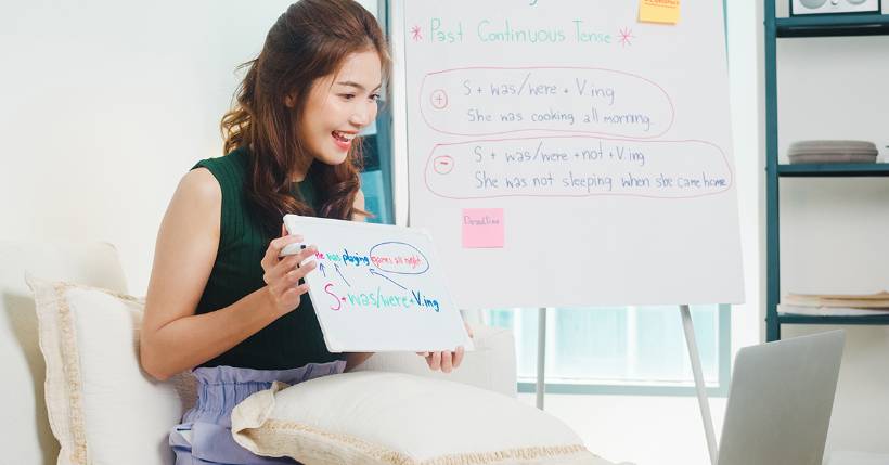 Teacher holding a whiteboard