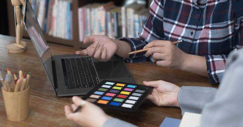 People collaborating on a laptop