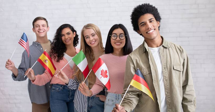 Group of people holding their culture's flags