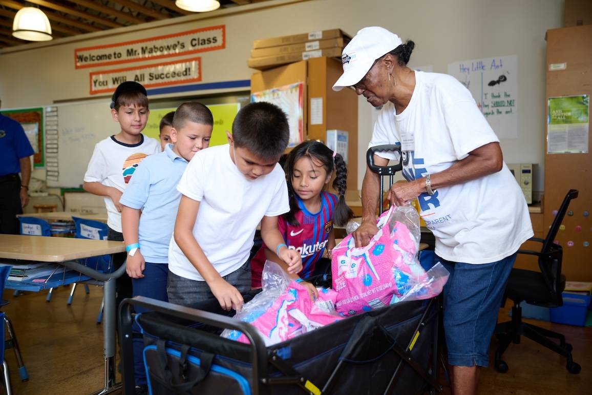Volunteer passing out cotton candy