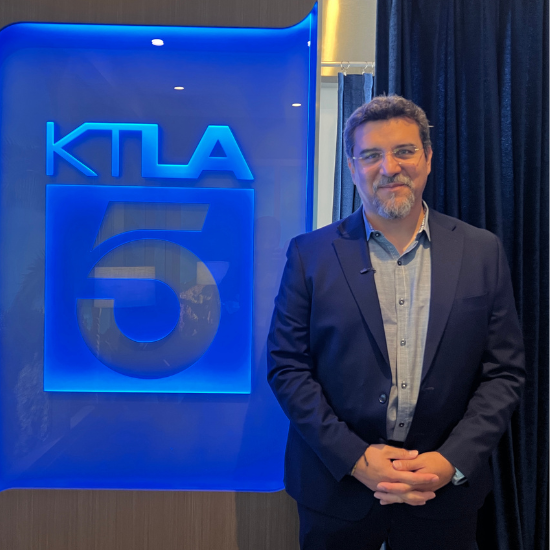 Dr. Miguel Gallardo standing next to the KTLA logo