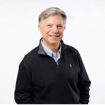 Headshot of Dr. Kent Rhodes in a dark quarter-zip sweater