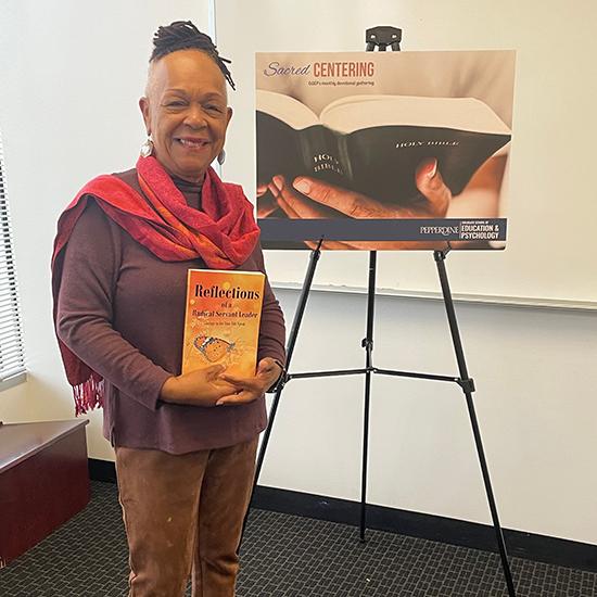 Loretta Randle holding a copy of her book