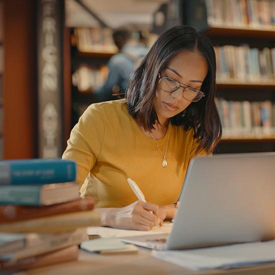 graduate student working on her paper