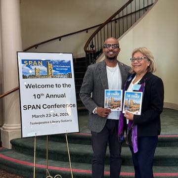 Terrelle Sales and Reyna García Ramos at the SPAN conference in March 2026, holding their latest joint publication
