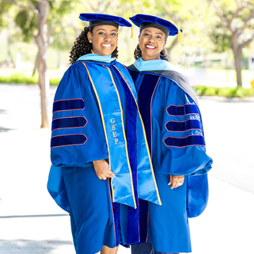 Rosalyn Robinson and Taylor photographed in graduate regalia. Donald Franklin, Graduation Portrait 2024