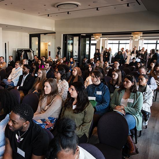 attendees of past SEC Collective event listening to a panel